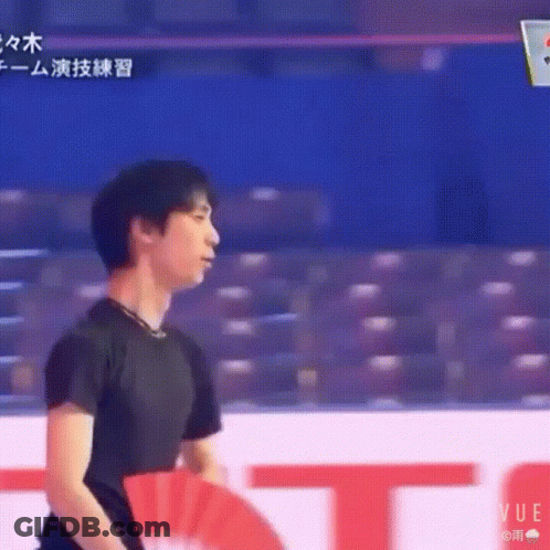 Man In Black Shirt At Red And White Vue Sign GIF