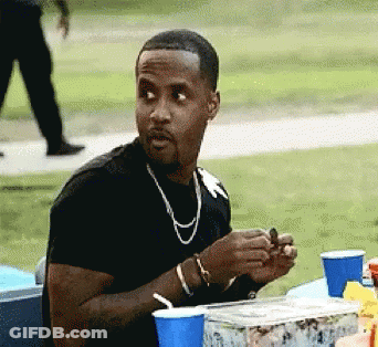 Man In Black Shirt At Table With Blue Cup GIF