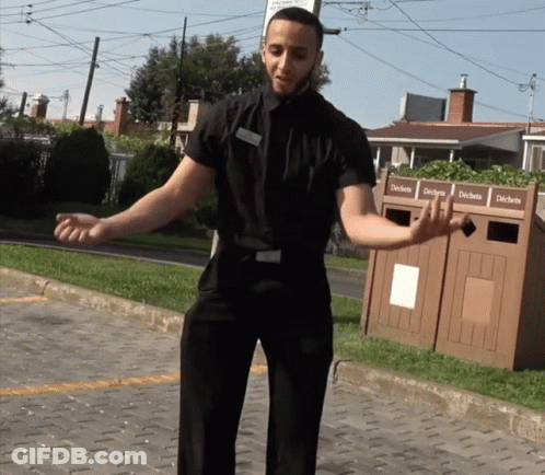 Man In Black Shirt By Trash Can Déchets GIF