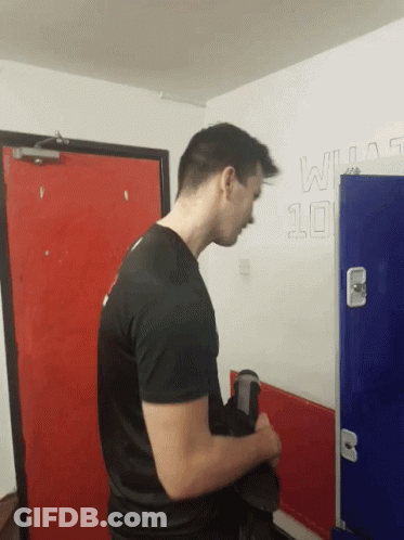 Man In Black Shirt By Wall With Number 10 GIF