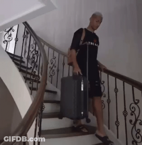 Man In Black Shirt Carrying Suitcase GIF