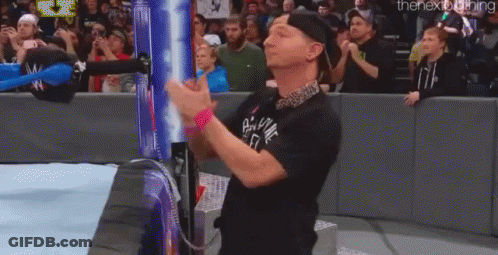 Man In Black Shirt Clapping At Wrestling Match GIF