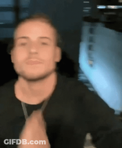 Man In Black Shirt Clapping In Front Of Window GIF