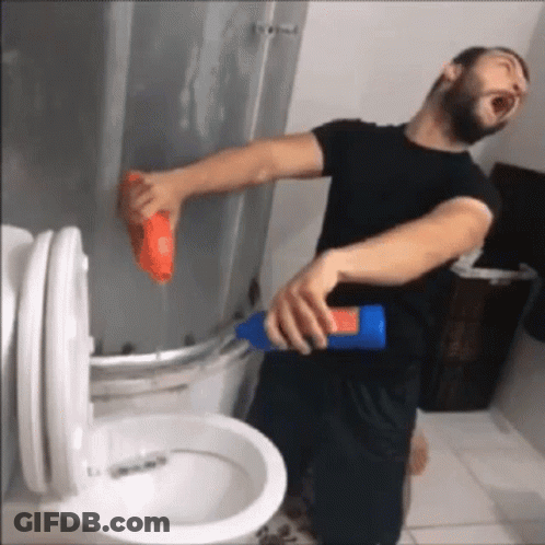 Man In Black Shirt Cleaning Toilet GIF