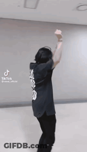 Man In Black Shirt Dancing Arms Up GIF