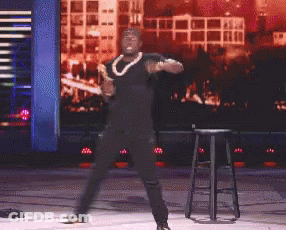 Man In Black Shirt Dancing On Stage GIF