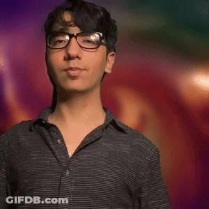 Man In Black Shirt Dancing With Arms Outstretched In Front Of Colorful Background GIF