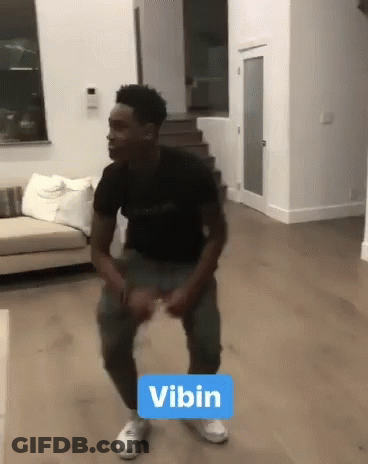Man In Black Shirt Dancing With Vibin Sign GIF
