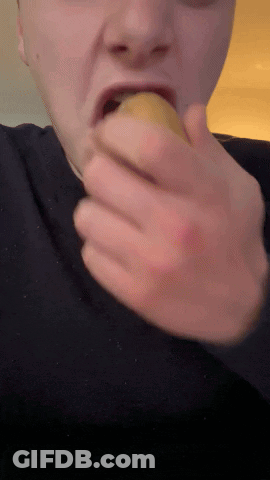 Man In Black Shirt Eating Banana GIF