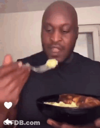Man In Black Shirt Eating Food GIF
