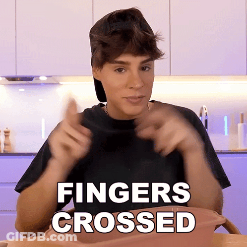 Man In Black Shirt Fingers Crossed GIF
