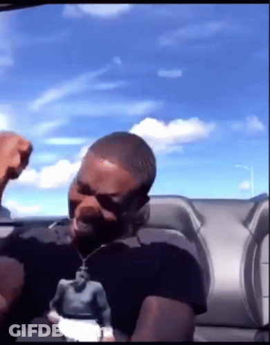 Man In Black Shirt Fist In Air GIF