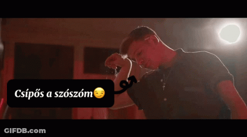 Man In Black Shirt Flexing Muscles GIF
