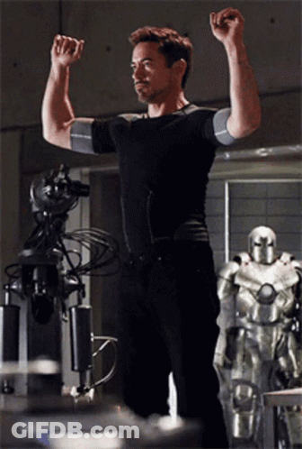Man In Black Shirt Flexing Muscles GIF