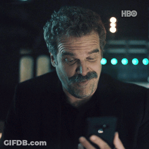 Man In Black Shirt Flexing Muscles GIF