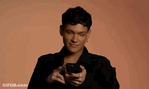 Man In Black Shirt Flipping Off With Phone GIF