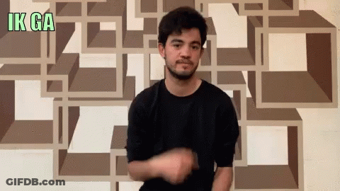 Man In Black Shirt Gesturing In Front Of Wall Saying Ik Ga GIF