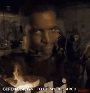Man In Black Shirt Giving Thumbs Up In Front Of Crowd GIF
