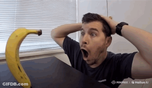 Man In Black Shirt Hailing Banana GIF