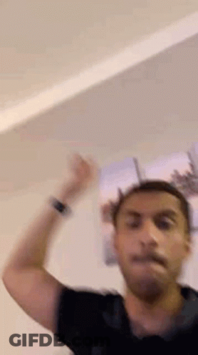 Man In Black Shirt Hand In Air GIF