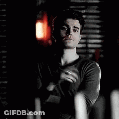 Man In Black Shirt Holding Candle GIF