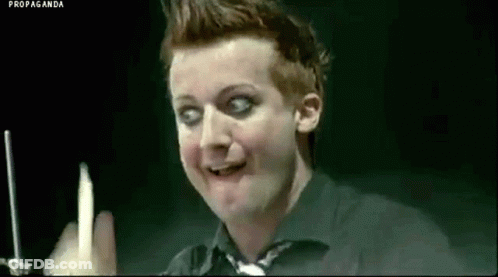 Man In Black Shirt Holding Candle Making Funny Face GIF