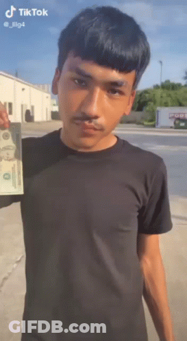 Man In Black Shirt Holding Dollar Bill GIF
