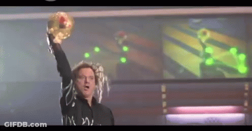 Man In Black Shirt Holding Donut GIF
