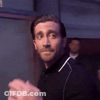 Man In Black Shirt Holding Fist Up GIF