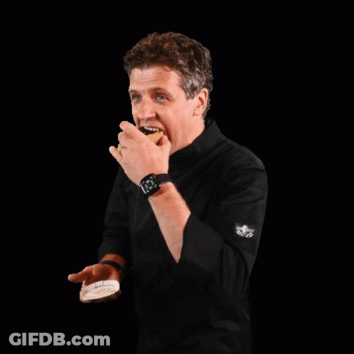 Man In Black Shirt Holding Food GIF