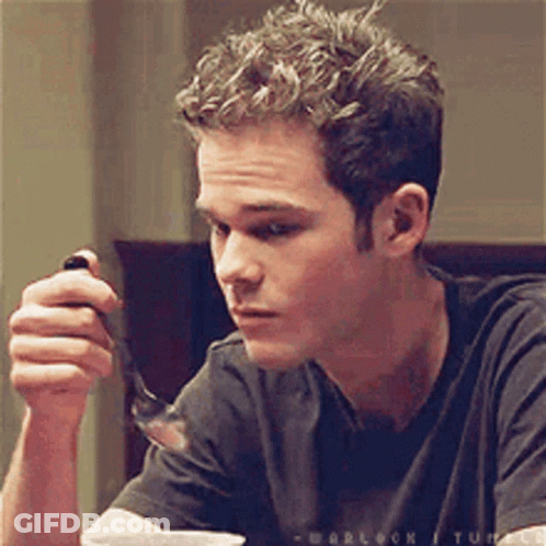 Man In Black Shirt Holding Fork GIF