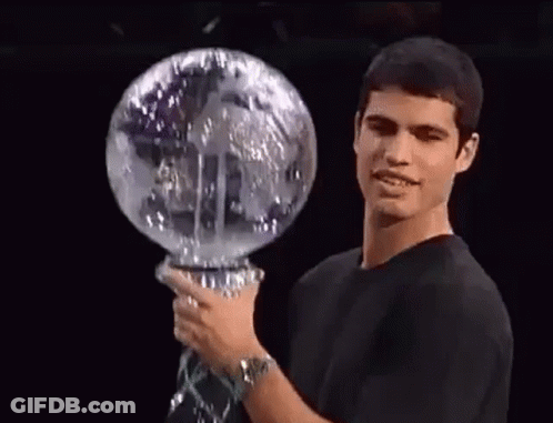 Man In Black Shirt Holding Glass Globe GIF