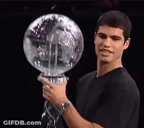Man In Black Shirt Holding Globe GIF