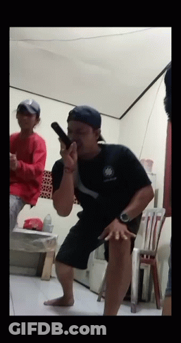 Man In Black Shirt Holding Gun GIF