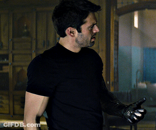 Man In Black Shirt Holding Gun GIF