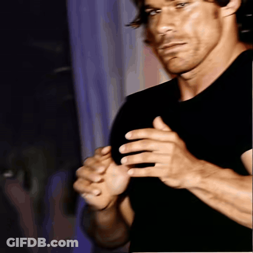 Man In Black Shirt Holding Hands Together GIF