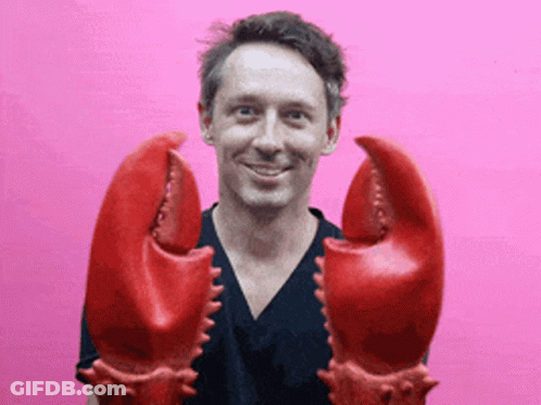 Man In Black Shirt Holding Lobster Claws GIF
