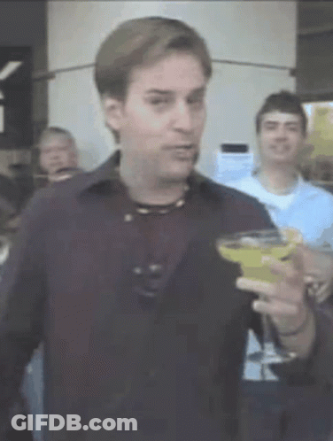 Man In Black Shirt Holding Martini GIF
