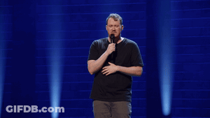 Man In Black Shirt Holding Microphone GIF