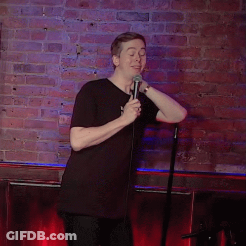 Man In Black Shirt Holding Microphone GIF
