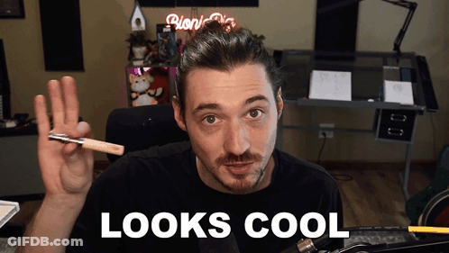 Man In Black Shirt Holding Pen Says Looks Cool GIF