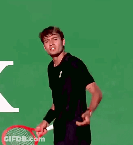 Man In Black Shirt Holding Tennis Racquet GIF