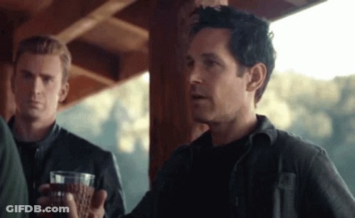Man In Black Shirt Holding Wine GIF