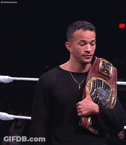 Man In Black Shirt Holding Wrestling Belt GIF