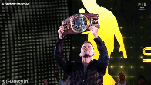 Man In Black Shirt Holding WWE Belt GIF
