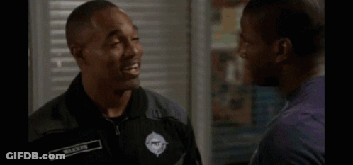Man In Black Shirt Hugging Another Man GIF