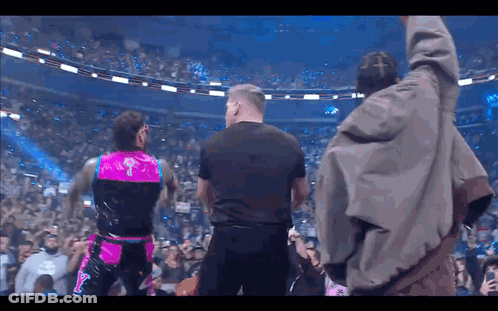 Man In Black Shirt In Crowd GIF
