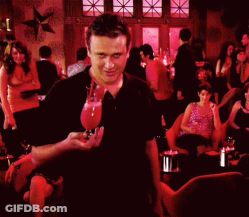 Man In Black Shirt In Crowded Bar GIF