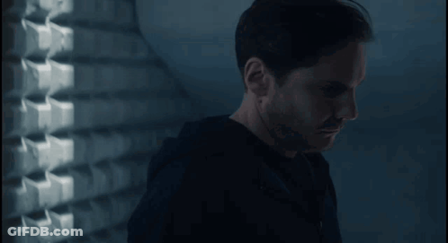 Man In Black Shirt In Dark Room GIF