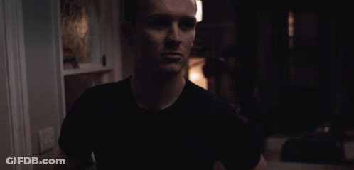 Man In Black Shirt In Darkness GIF